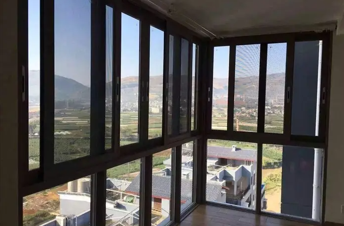 How should the screens of windows and doors be cleaned?